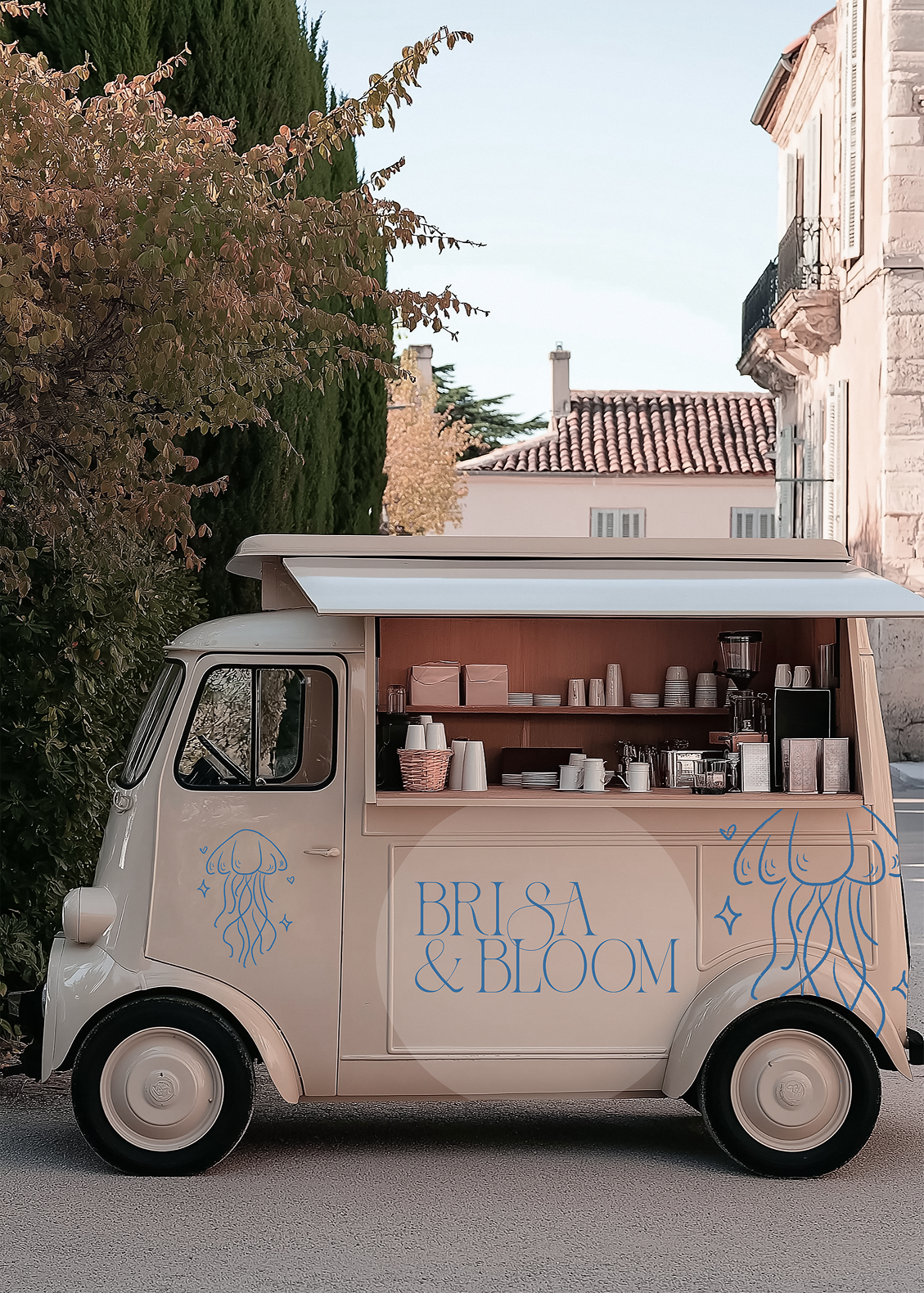 A small beige mobile coffee truck with blue jellyfish illustrations and the text "Brisa & Bloom" on the side, parked outdoors with trees and buildings in the background.