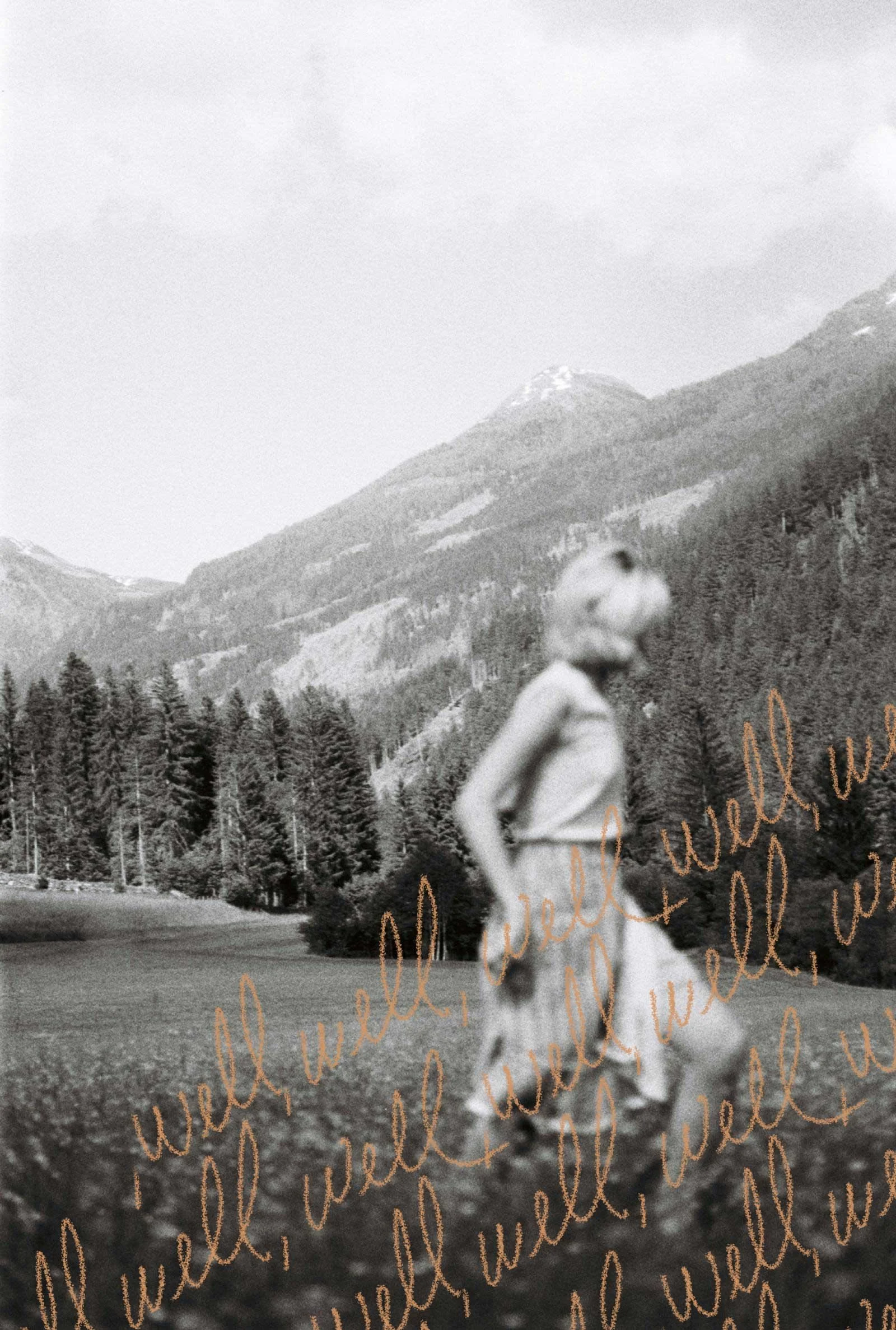 A person with short light hair, in a sleeveless top and skirt, standing in a field with mountains and trees in the background; the photo is overlaid with the word 'well' written repeatedly in orange cursive.