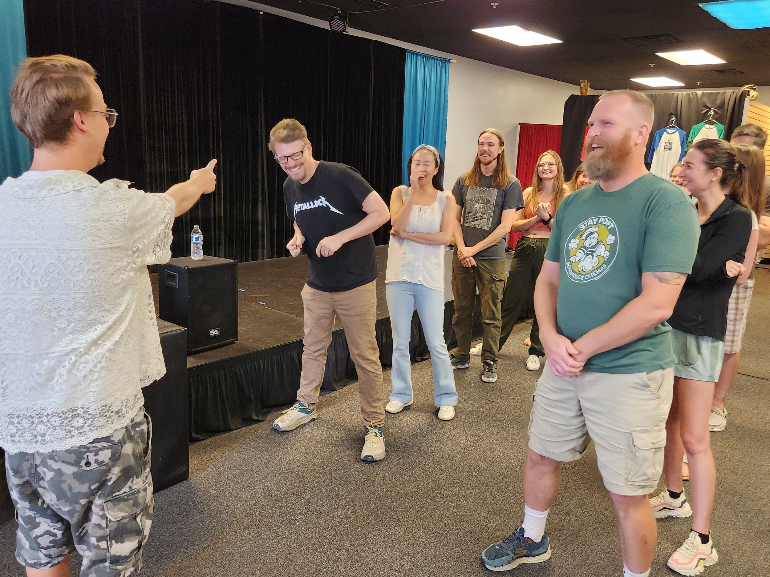 Improv class participants laughing together and building connection