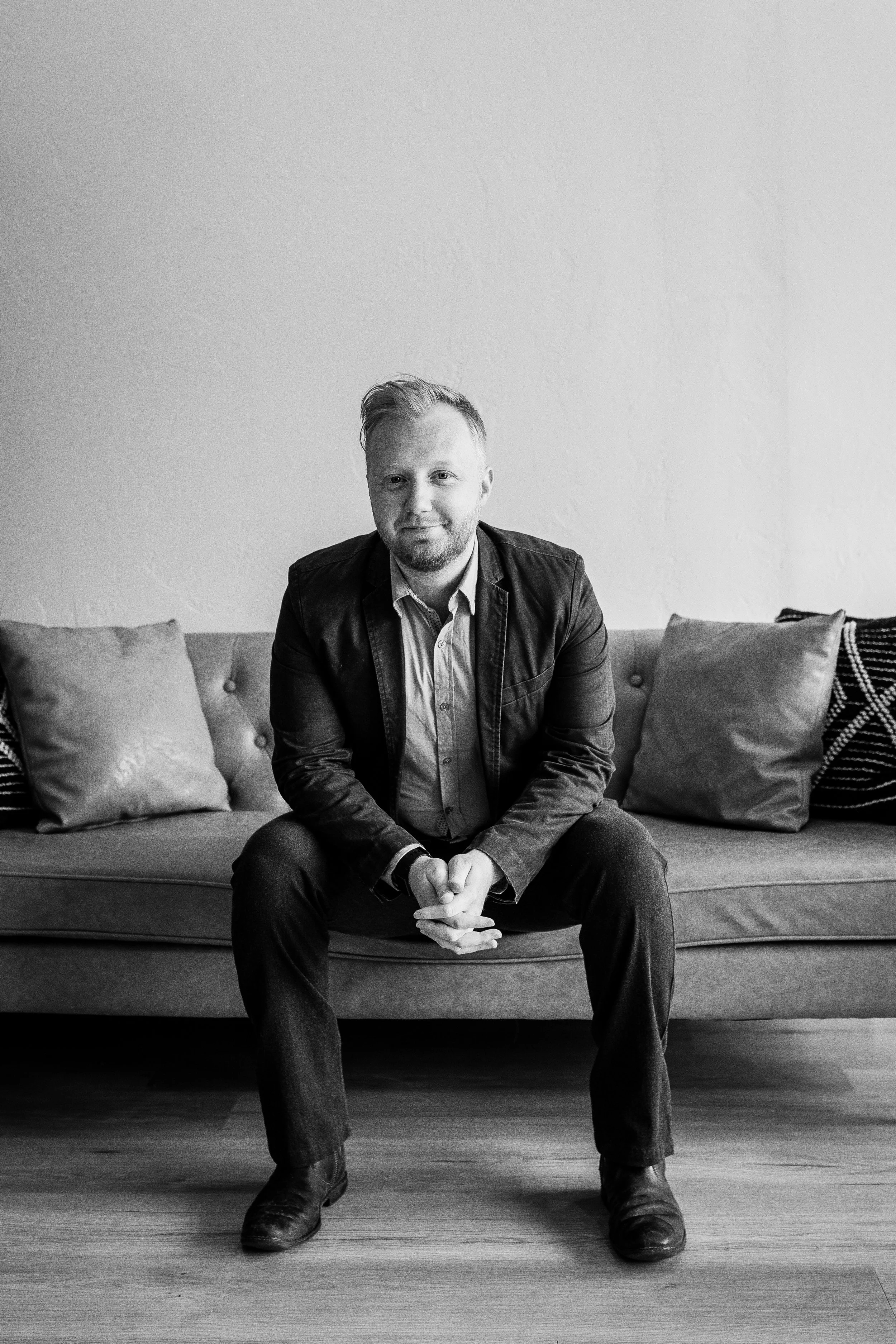 Headshot of Johnny Wilson, Tune Titans performer and creator of the tabletop role-playing game Teamup at Peak Improv Theater.