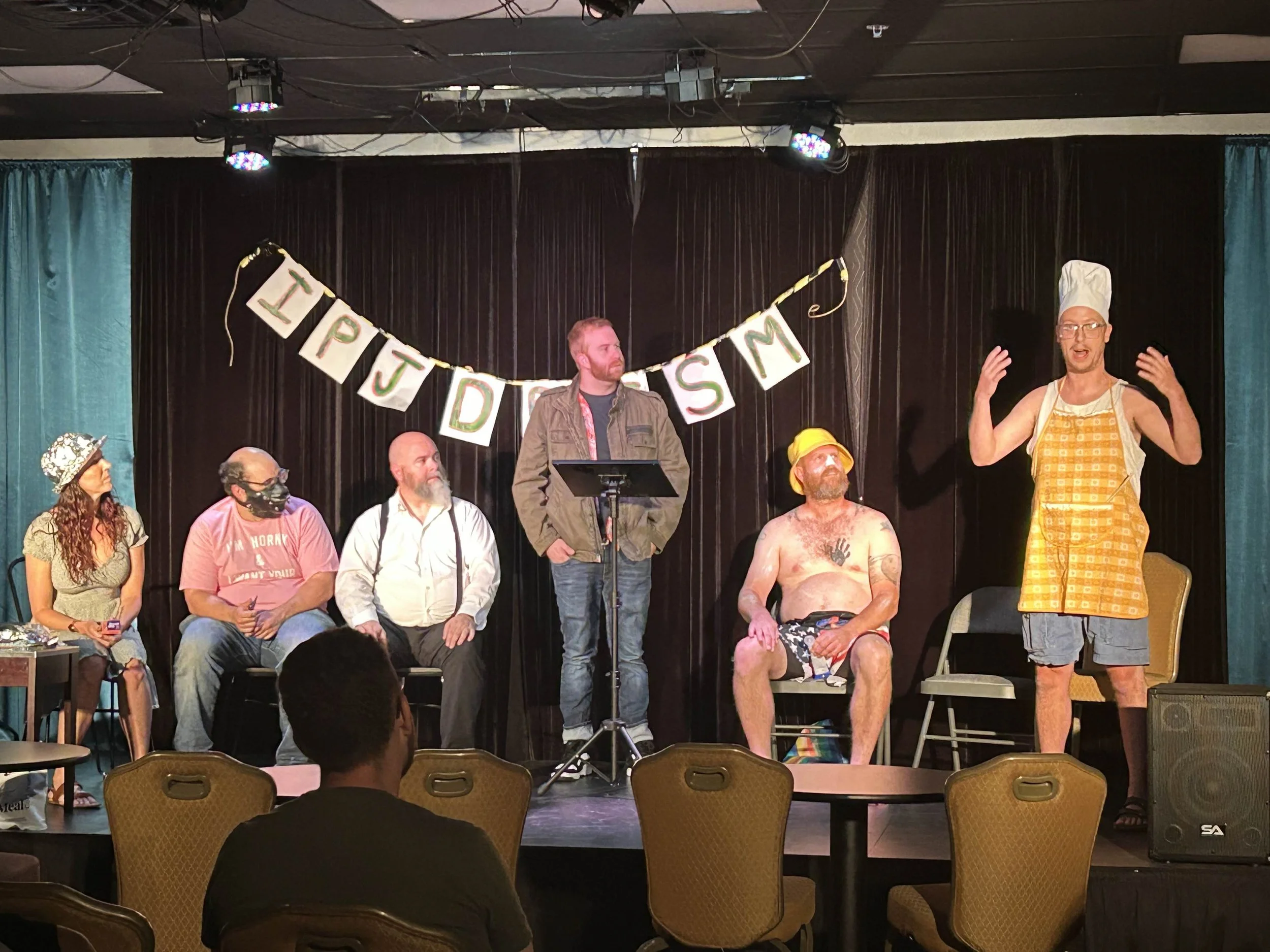 improv performers listening and reacting during a scene.