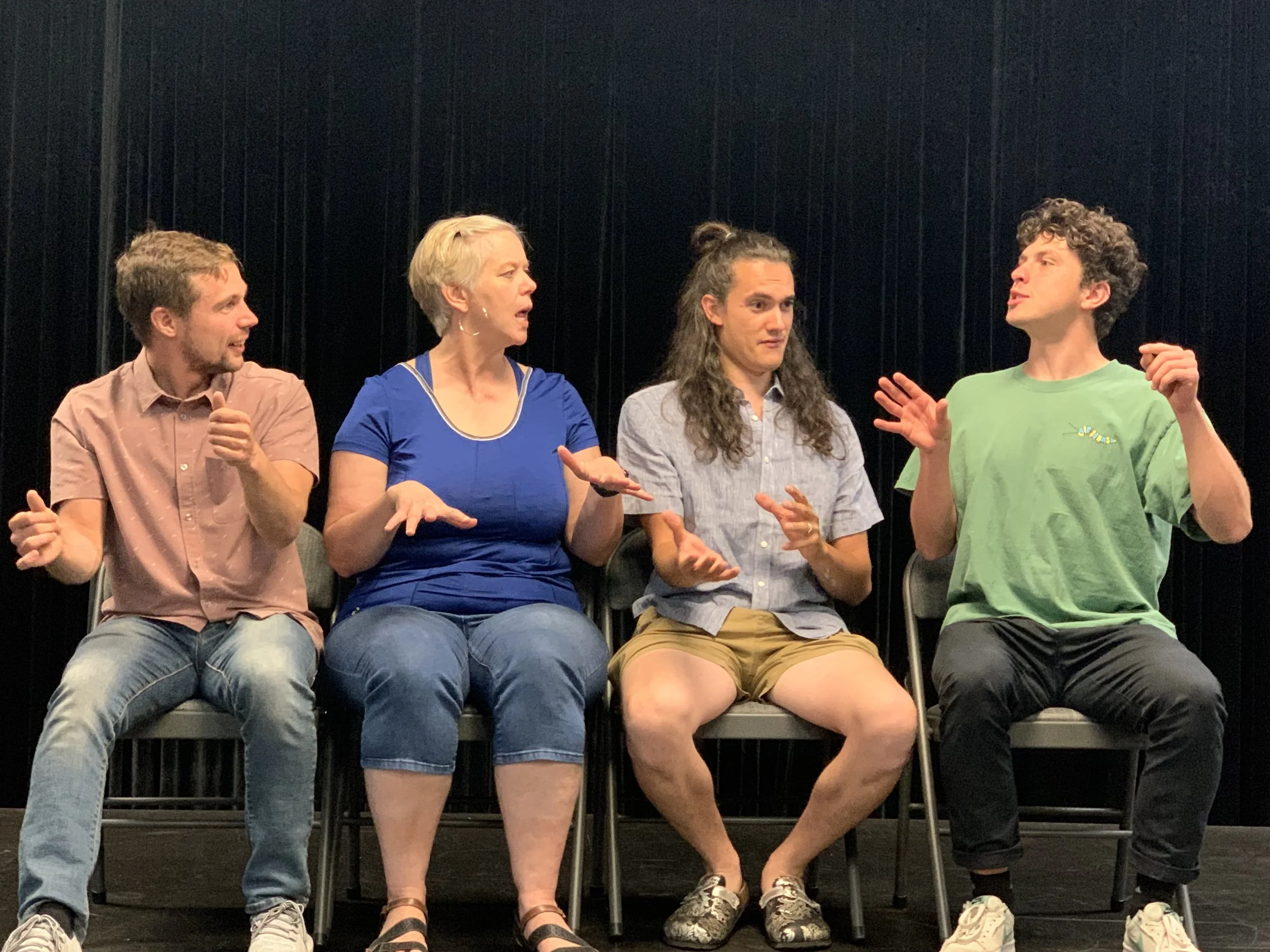 improv students laughing together during a Peak Improv Theater class