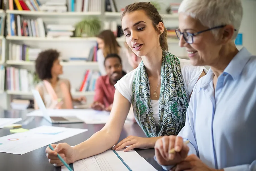Two participants in an economic education course