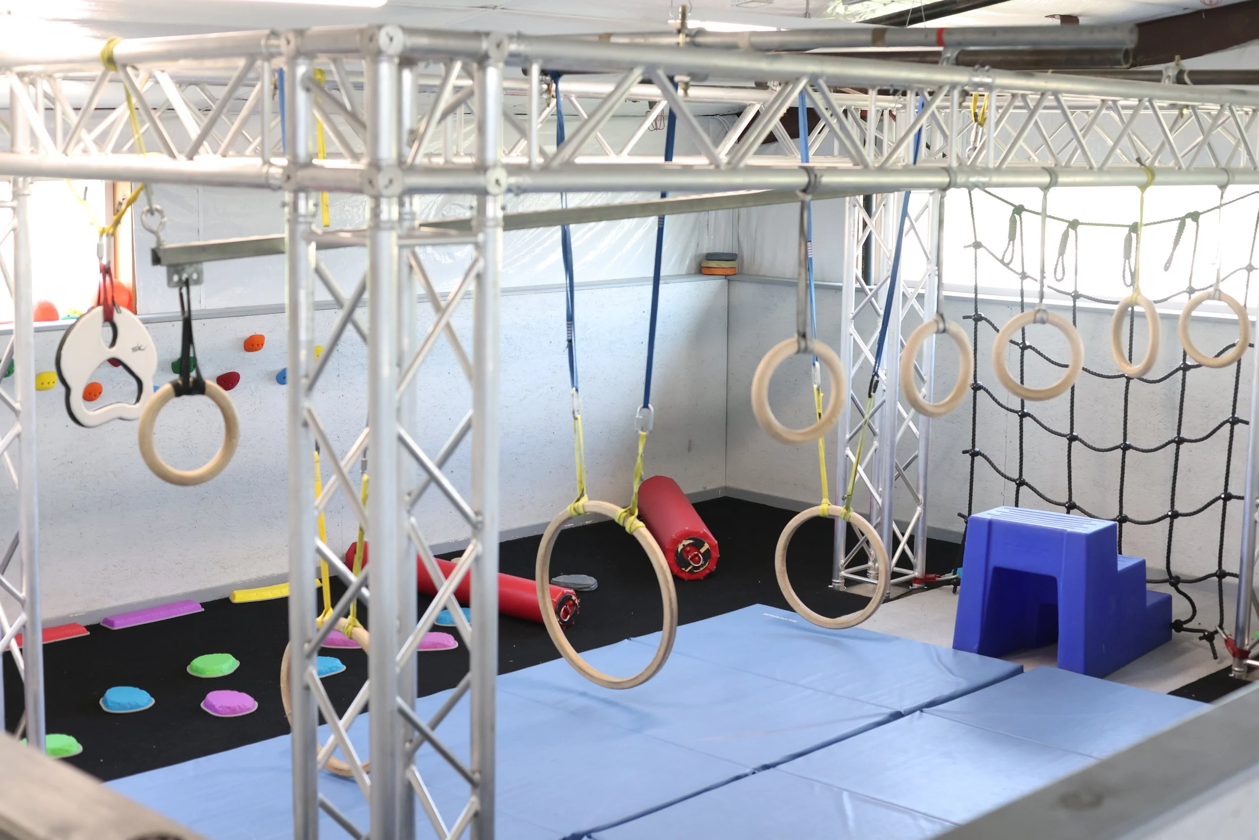 Mini Ninjas area for 2-4 year olds with balance courses, rings, and other fun obstacles.