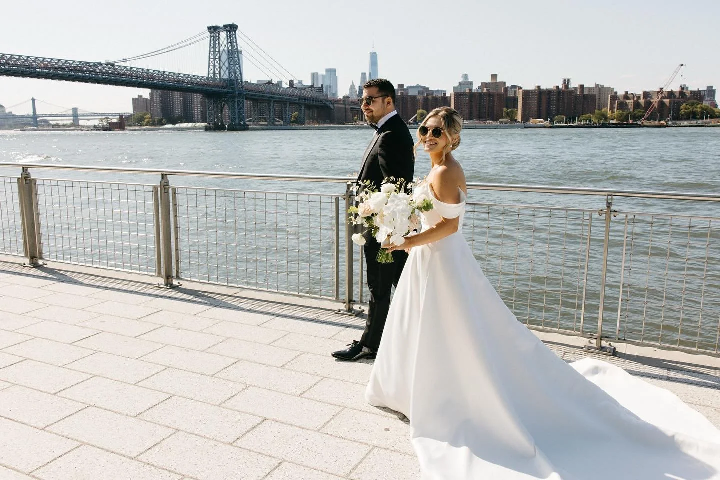 Before their ceremony at the @WytheHotel, Maya and Elias snuck away to the Williamsburg waterfront (their own backyard!) for an iconic photo sesh with @weddingsbynato 💙