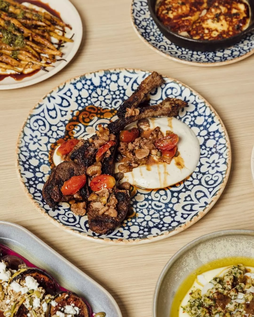 Lamb tomahawk mashawi with smoky eggplant labneh, tomato &amp; walnut B'Zeit, and mulberry molasses ~ one of our favourite mezze dishes&nbsp;🍽️

A meal at INARA is more than just food - it&rsquo;s an experience. Come and taste the flavours of the Mi