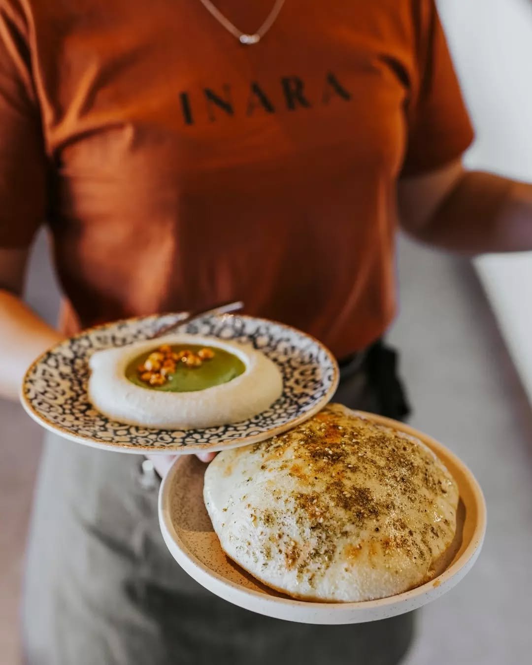 A pillowy bazlama bread, hot from the oven, and a swirl of creamy hummus topped with chickpeas and zhoug.

An excellent start to any meal ~ just remember to keep some bread for your mains! ✨