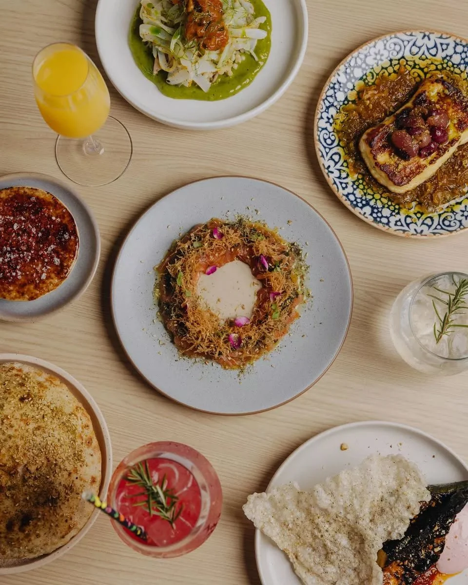 This is what lunch at INARA looks like ✨

Shark Bay cuttlefish. Halloumi with charred grapes. Za'atar-cured salmon. Blackened courgette. Bazlama warm from the oven. A spritz, white wine or mimosa, too.

The new Autumn menu is here ~ and it wants to b