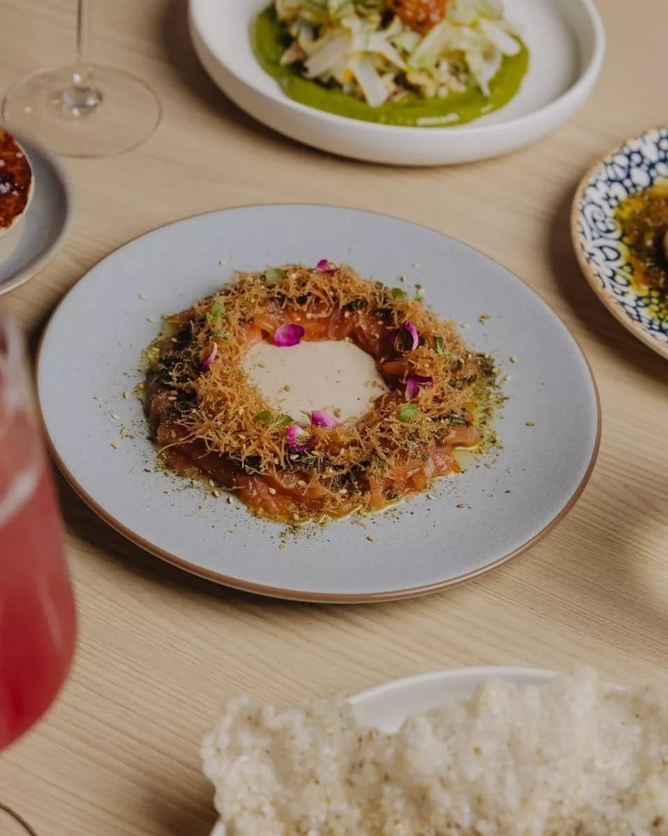 A dish that looks exactly as good as it tastes.

Za'atar-cured Tasmanian salmon ~ rose-tahina, crispy kataifi, rose petals, lemon balm. A wreath of flavour on a plate.

On the Autumn menu now ~ book the link in bio.