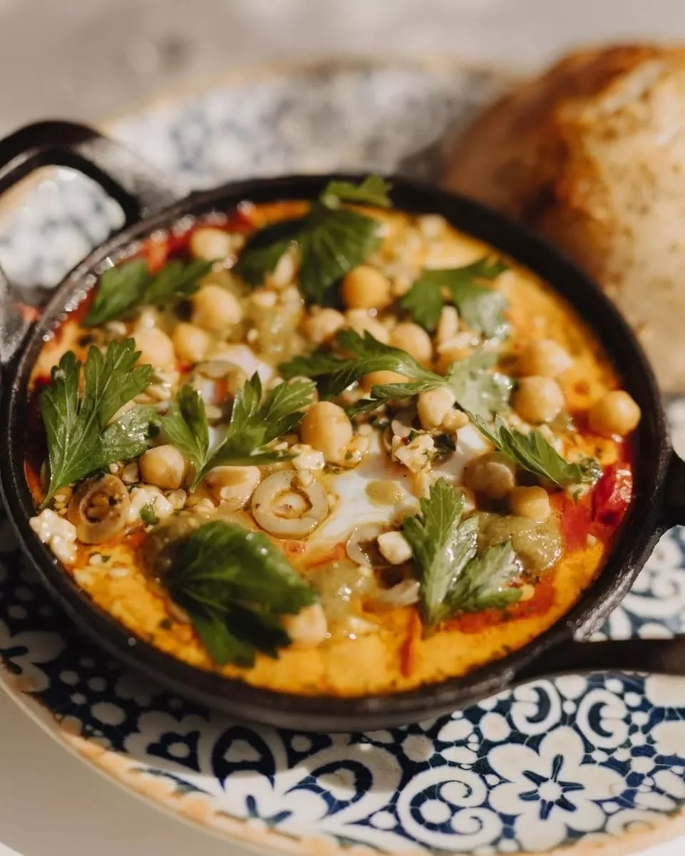 Slow mornings, done right. Sunday brunch at INARA is the kind of table you don't want to leave. ✨

This is our famous Shakshuka ~ we start by braising tomatoes and peppers, then add eggs which are slowly baked, then top it with feta and green olives.