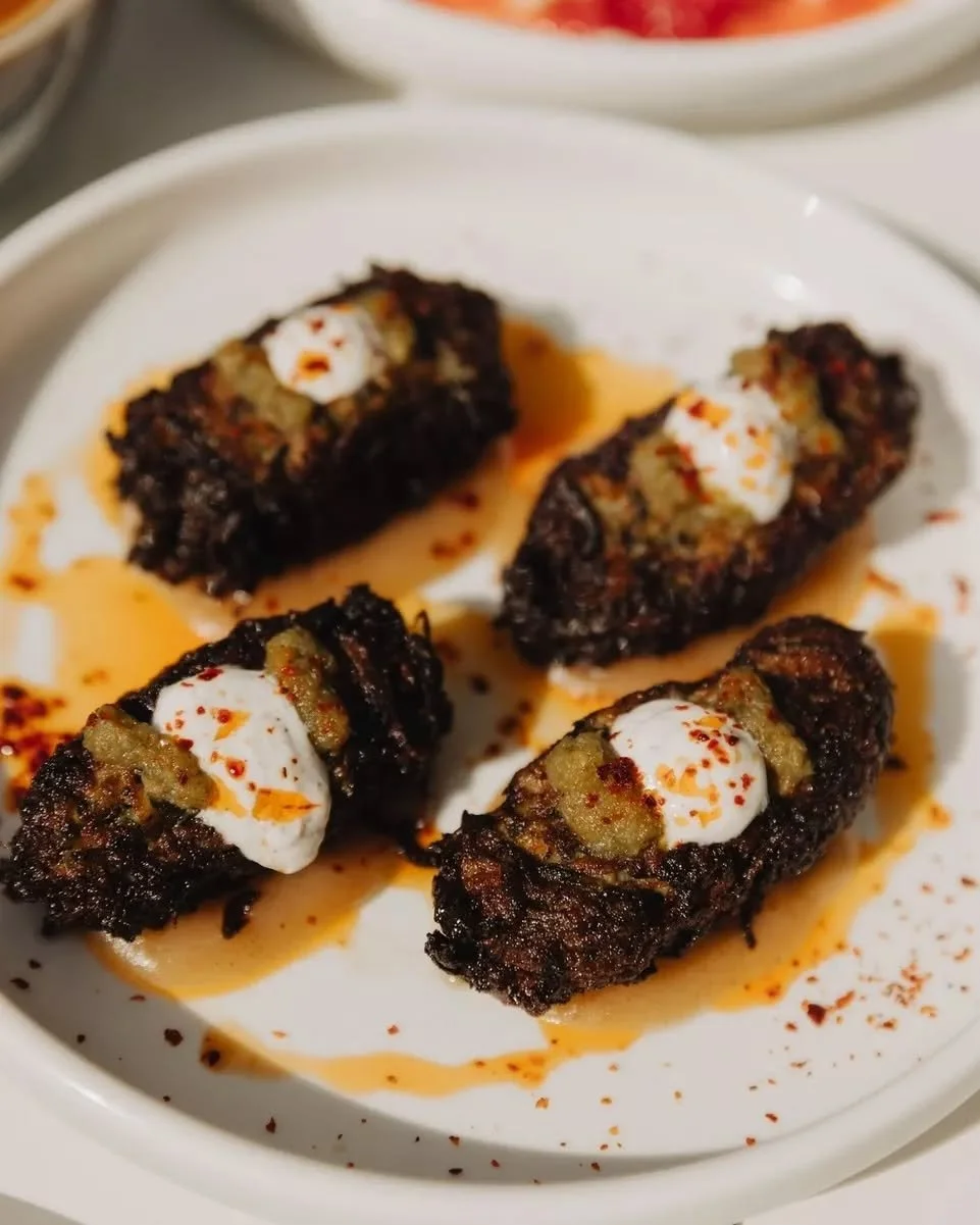 They may not be the most aesthetic dish on the menu, but diners have been known to order seconds!

Courgette, feta + mint fritters, topped with sumac yoghurt and shatta hot sauce. 

Quiet over-achiever at Sunday brunch ❤️