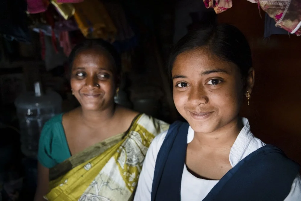 A mother looks at her daughter with pride in a rural village in West Bengal