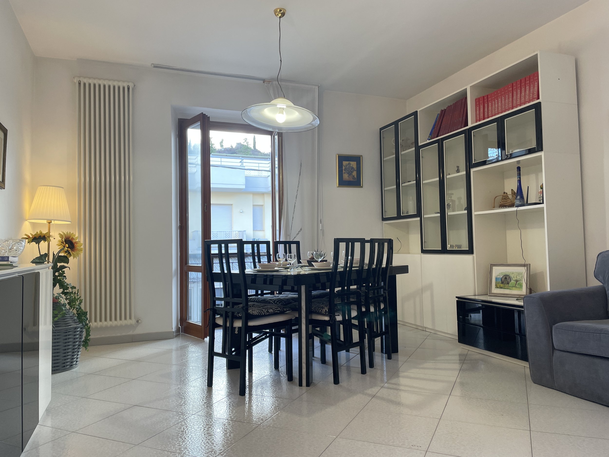 Dining table with doors to balcony