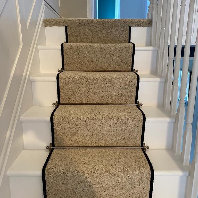 A beautifully crafted stair runner in #naturalberberelite -#morningdew by @cormarcarpets finished with easy binding and antique brass stair rods. We can cut and bind a runner in the carpet of your choice-visit our showroom to look through our samples