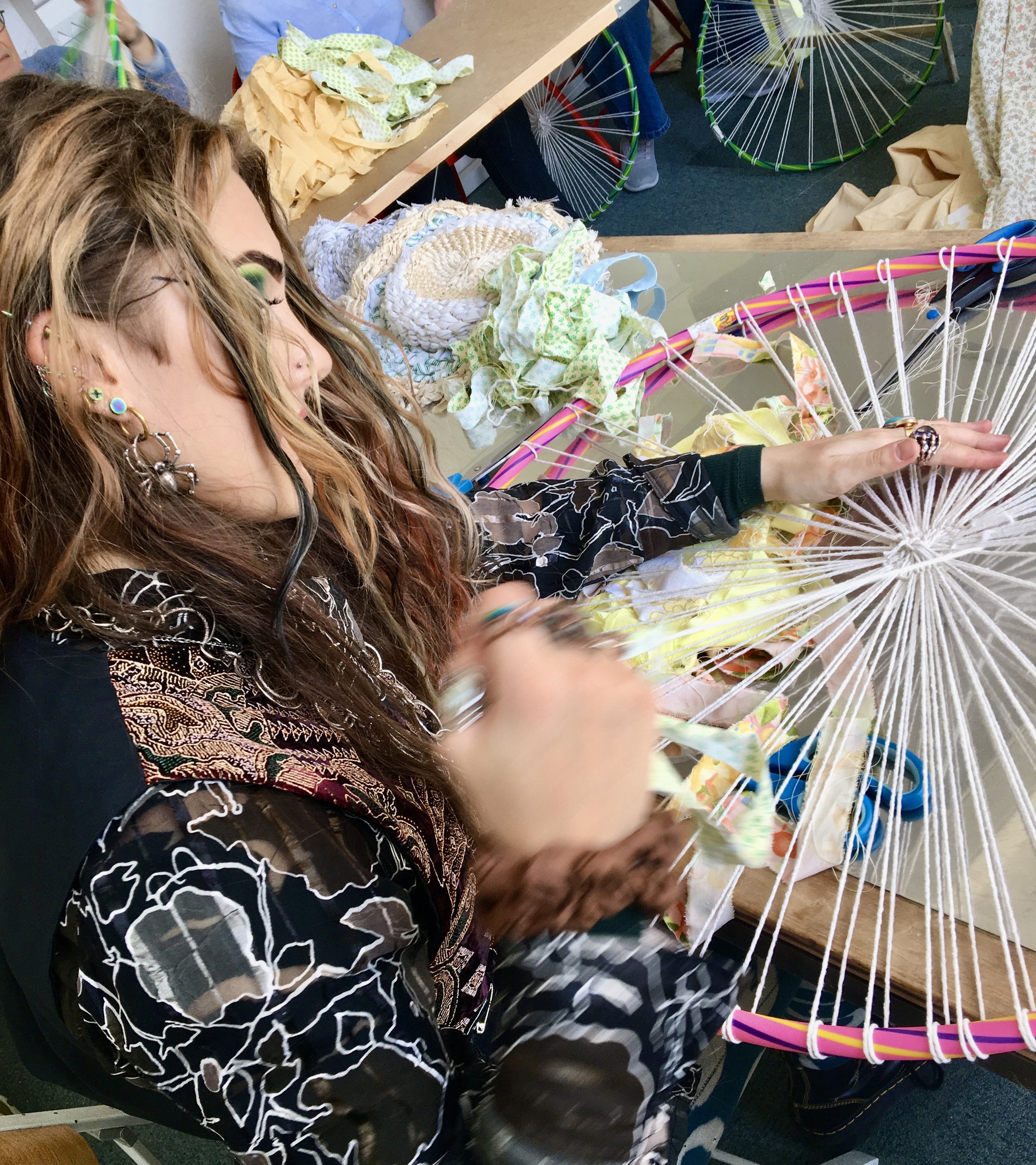 Zara-lea Field weaving on a hula hoop.jpeg