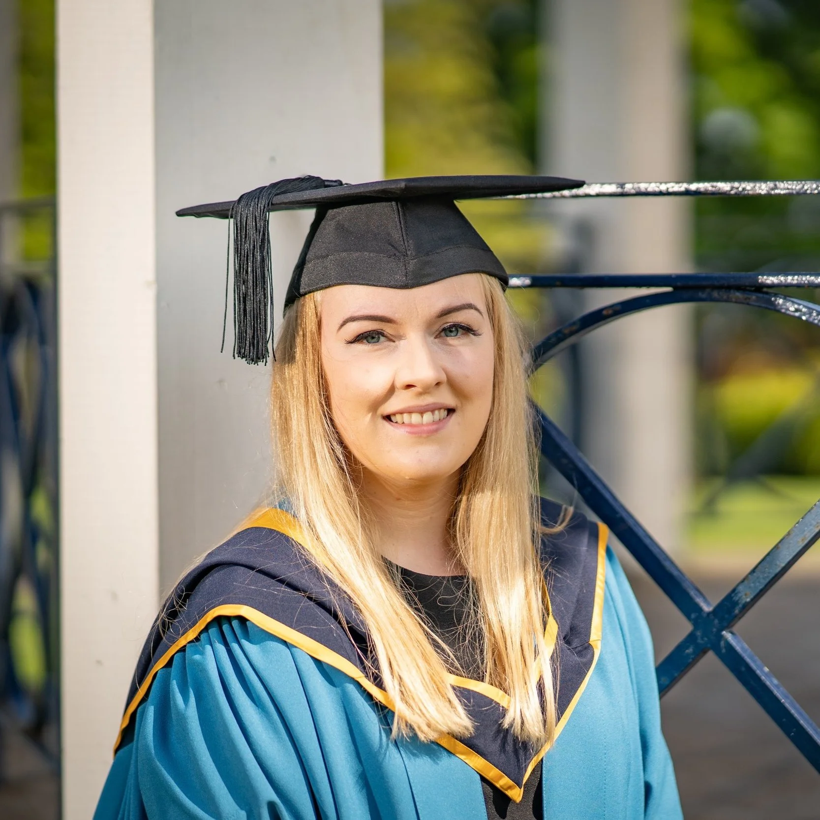 Picture of Erin in her graduation gown and cap.