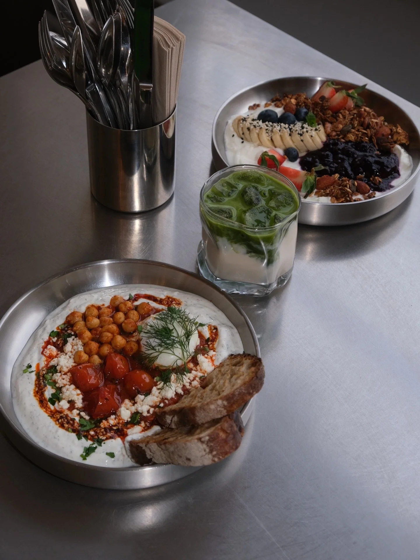INSTINCT SHUKA 🔥 
Greek yogurt with garlic &amp; herbs, spiced tomato-pepper sauce, chickpeas, poached egg, feta, parsley &amp; chili crunch.