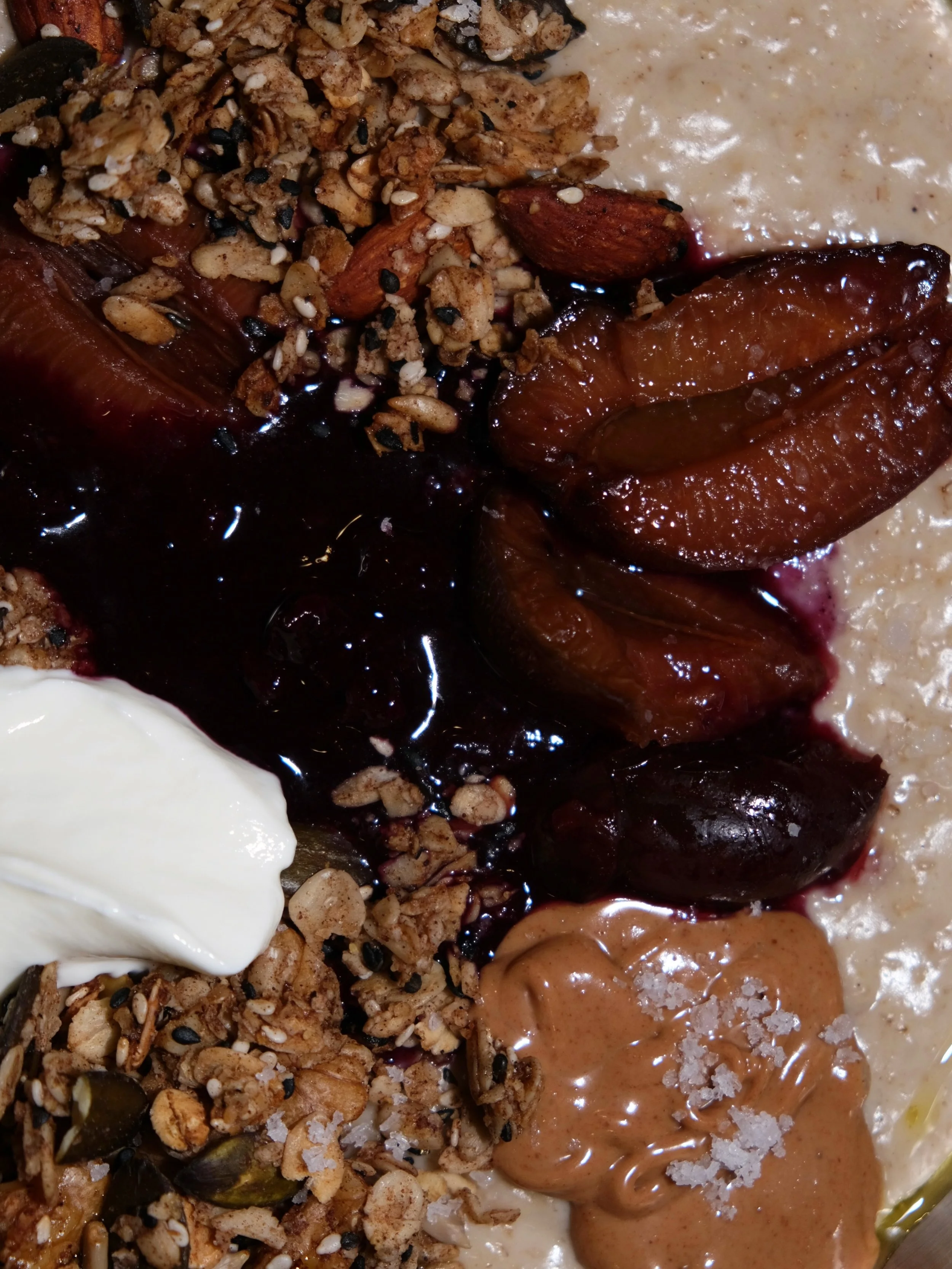 warm oat porridge, cardamom-blueberry compote, oven-roasted plums, greek yogurt, granola, almond butter &amp; olive oil