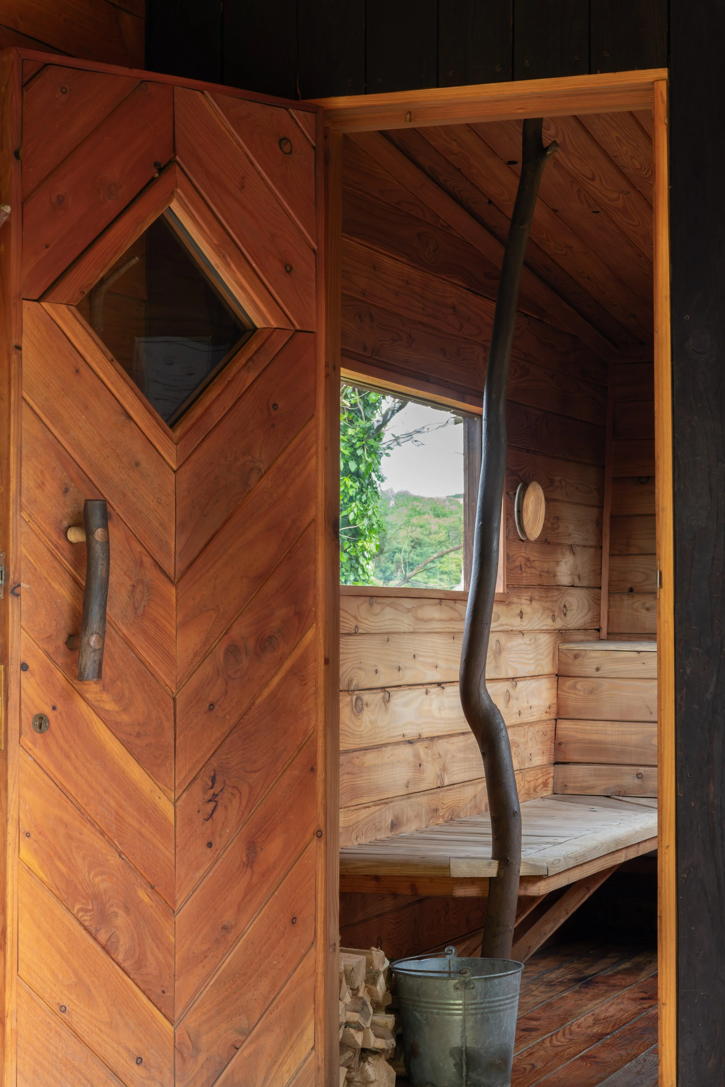 Looking inside handcrafted mobile wooden sauna