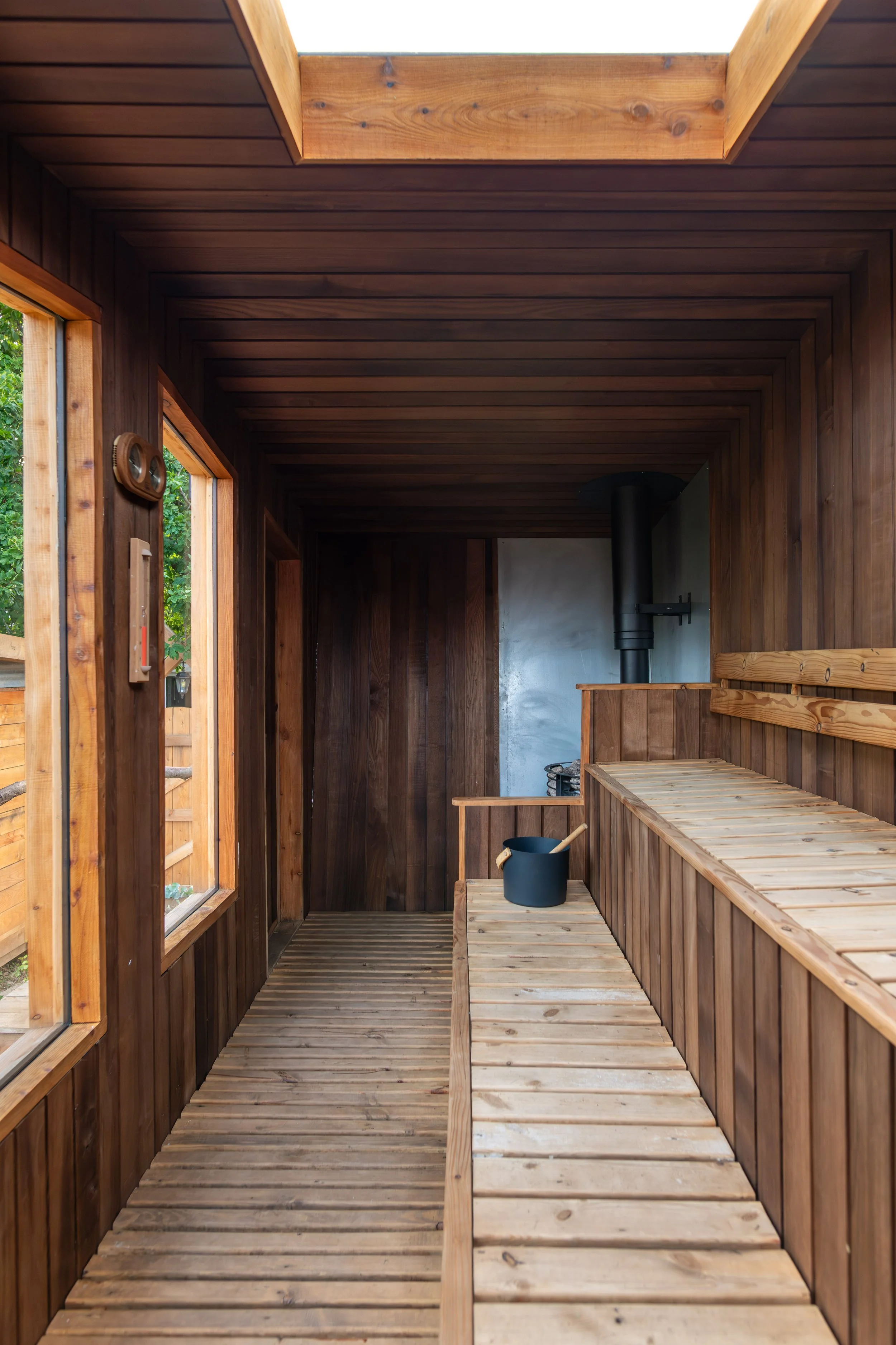 Two-level wooden benches inside high-spec custom sauna