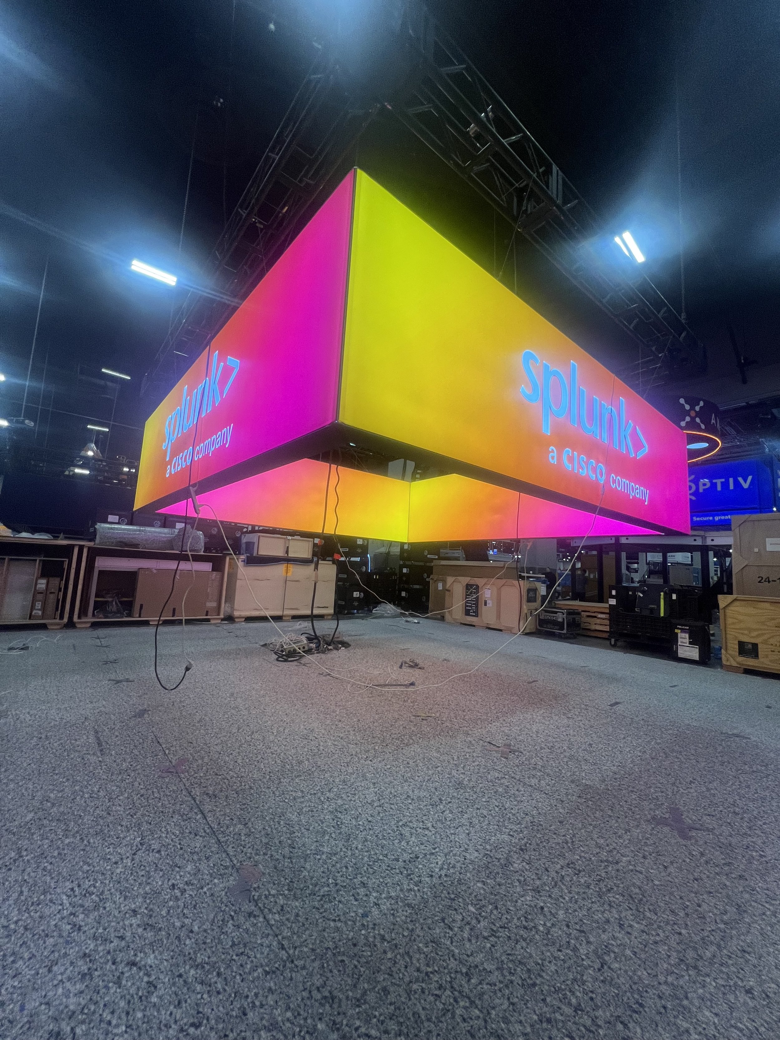 Showbox Exhibits Large illuminated "Splunk" display hanging from ceiling structure