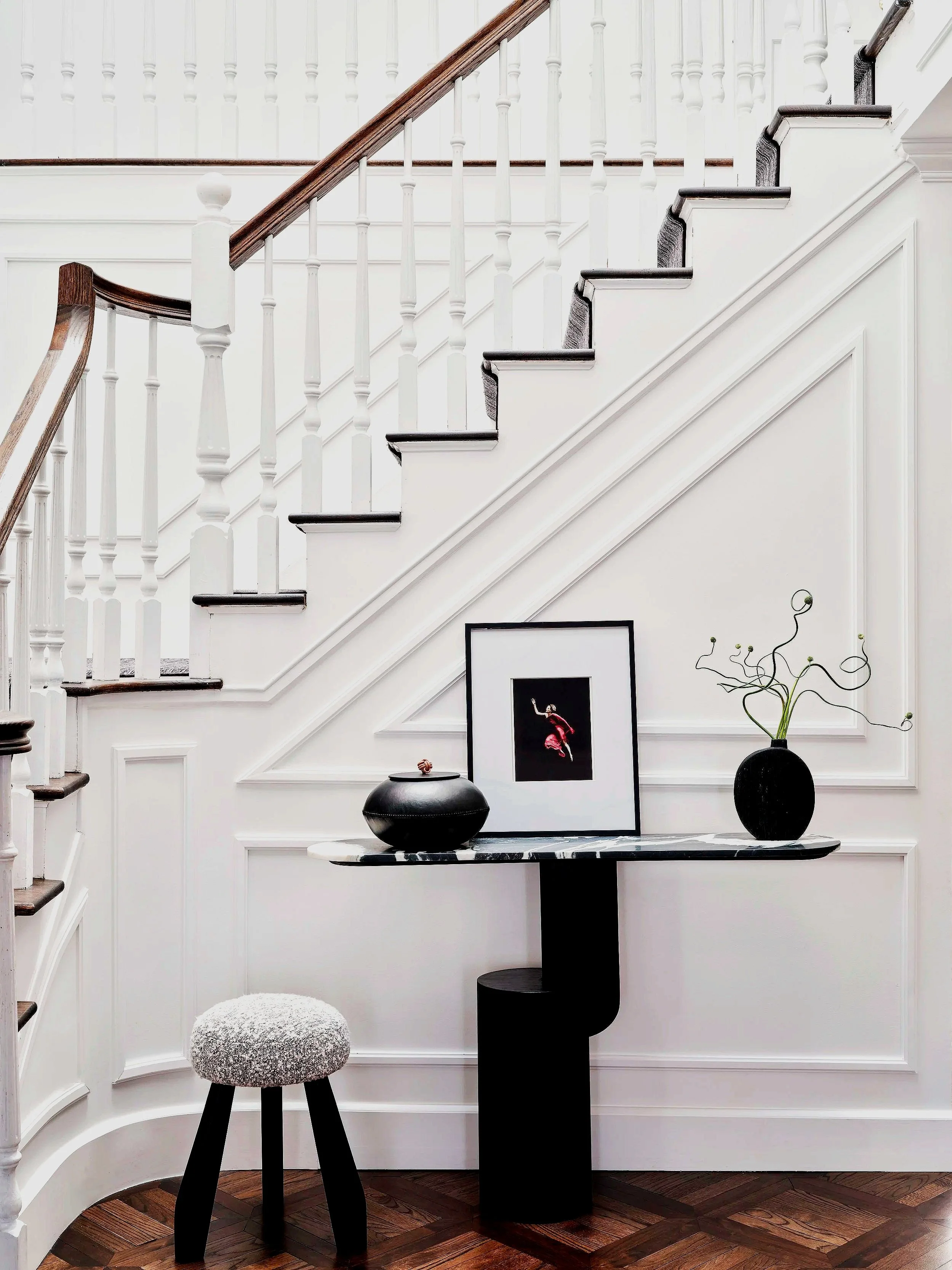 Foyer Design, with custom abonized console table, millwork designed to complement stairs, Luxury home in Woodbury.