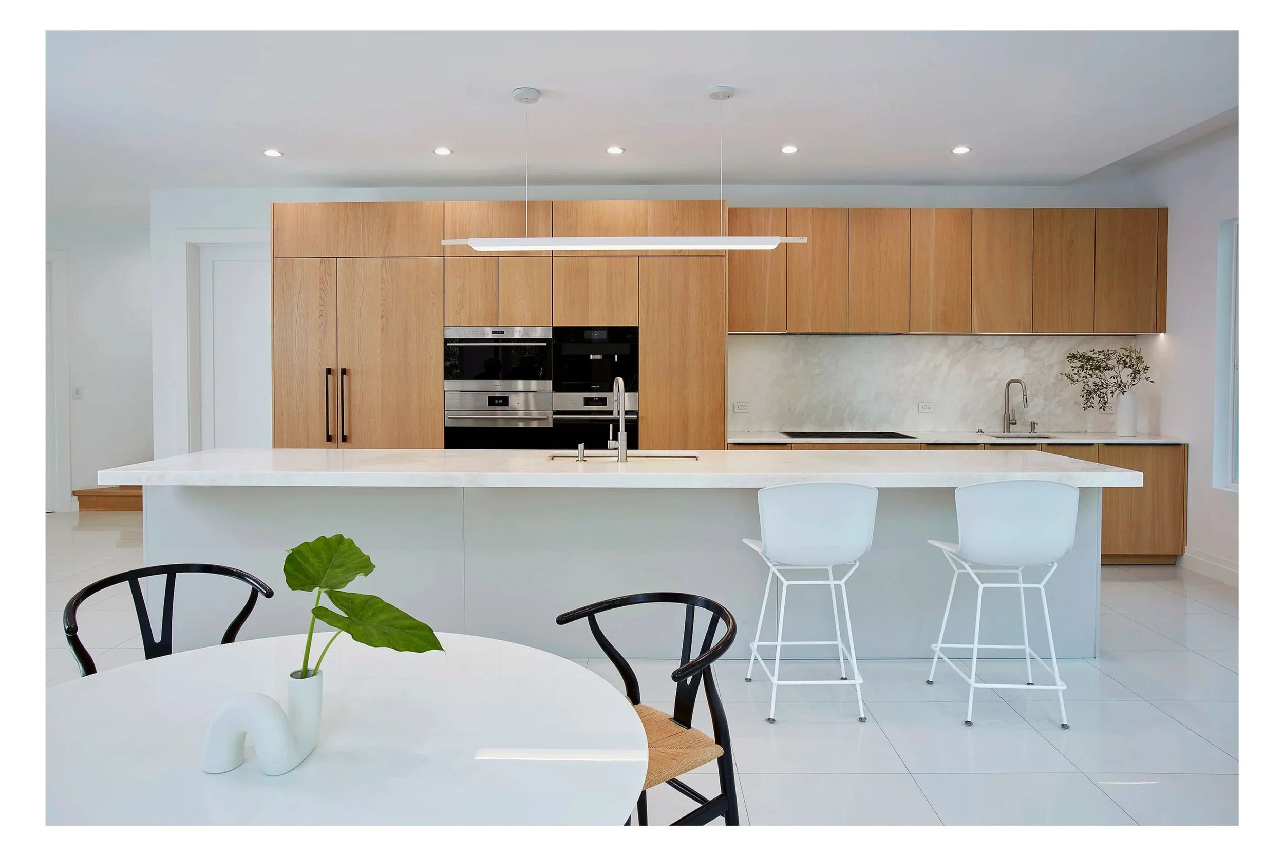 Sleek and Modern Kitchen Design in Sands Point, Long Island NY. Warm, bright and functional.