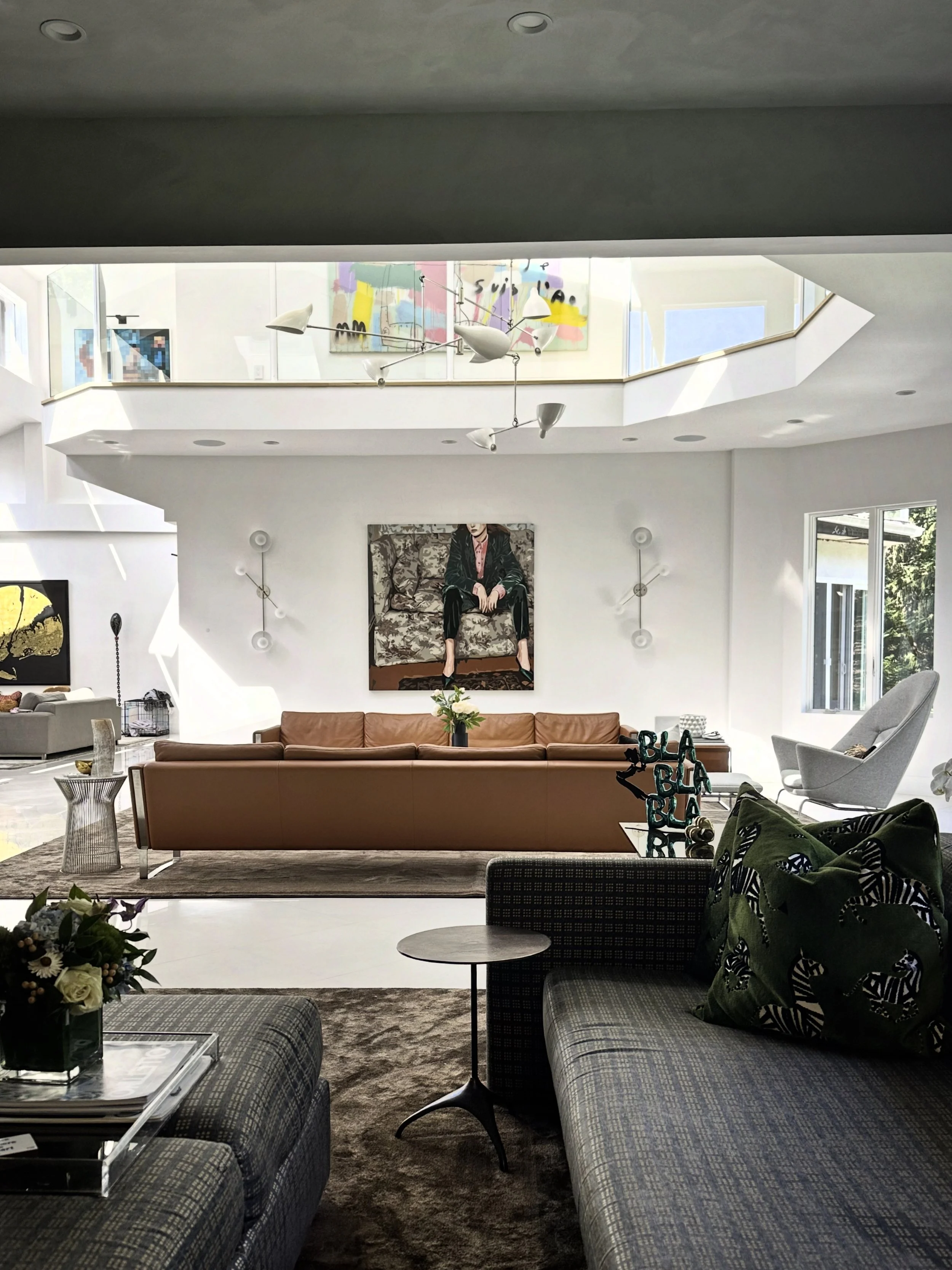 Modern Living Room with double height, open floorplan with warmth, layers and comfort. Luxury and comfort all in one space. 