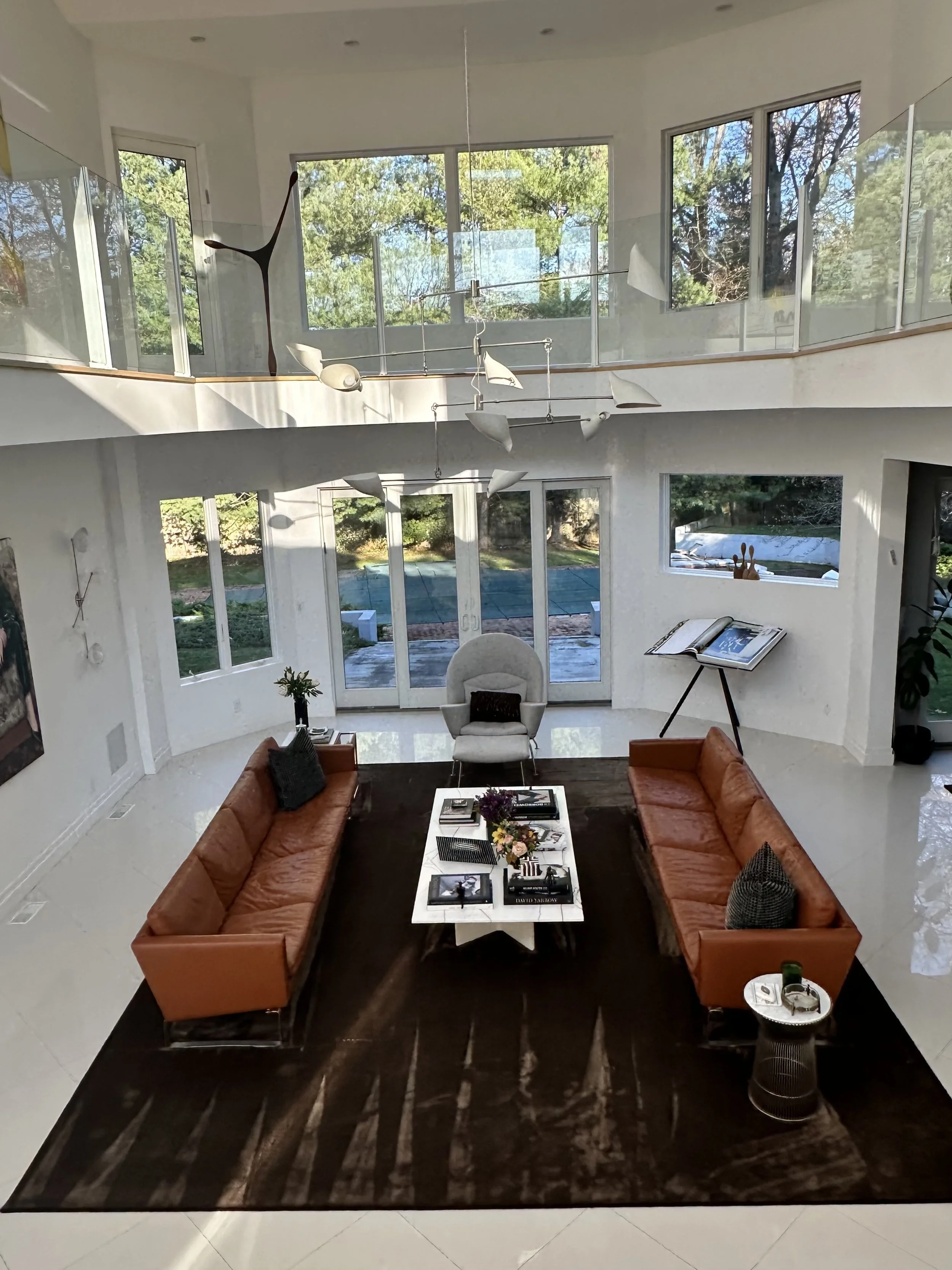 Modern Living Room with double height, open floorplan with warmth, layers and comfort. Luxury and comfort all in one space. 