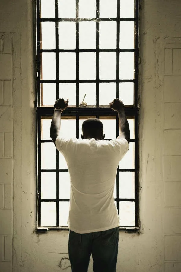 Man in prison window