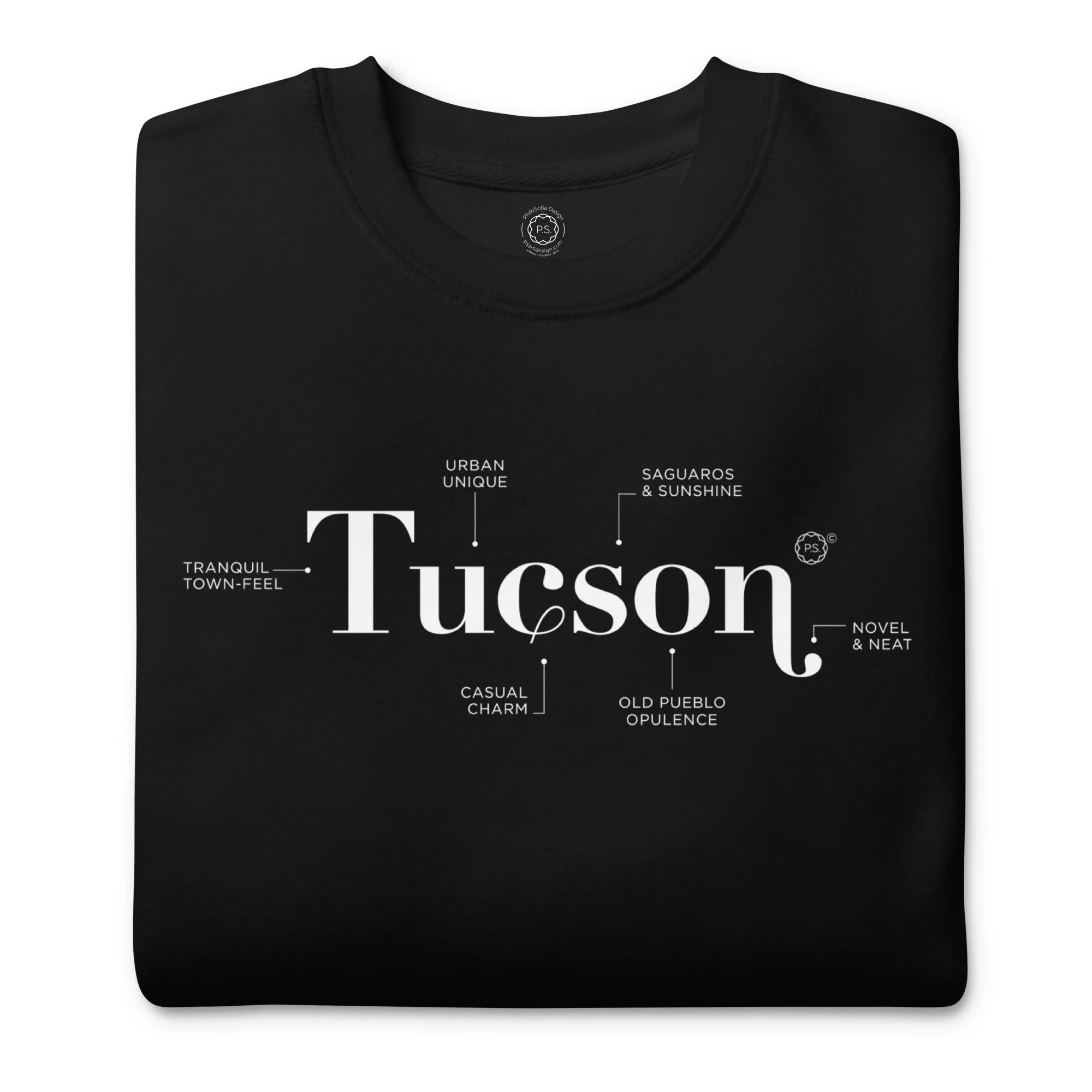Close up of folded super soft Tucson Defined minimalist graphic sweatshirt in chic Black.