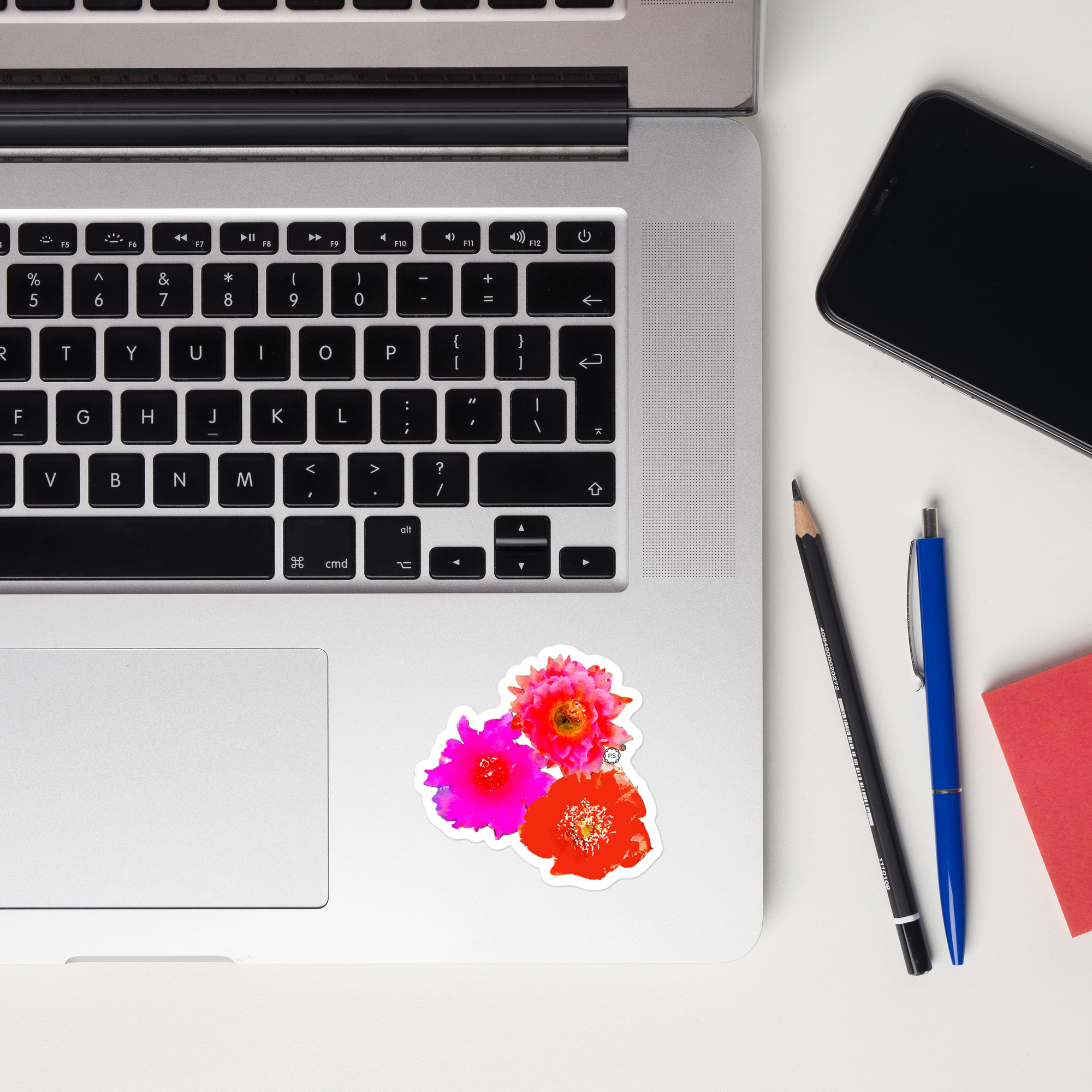 Bright pink, violet and red Cactus Flowers Sticker applied to inside of mac book lap top.