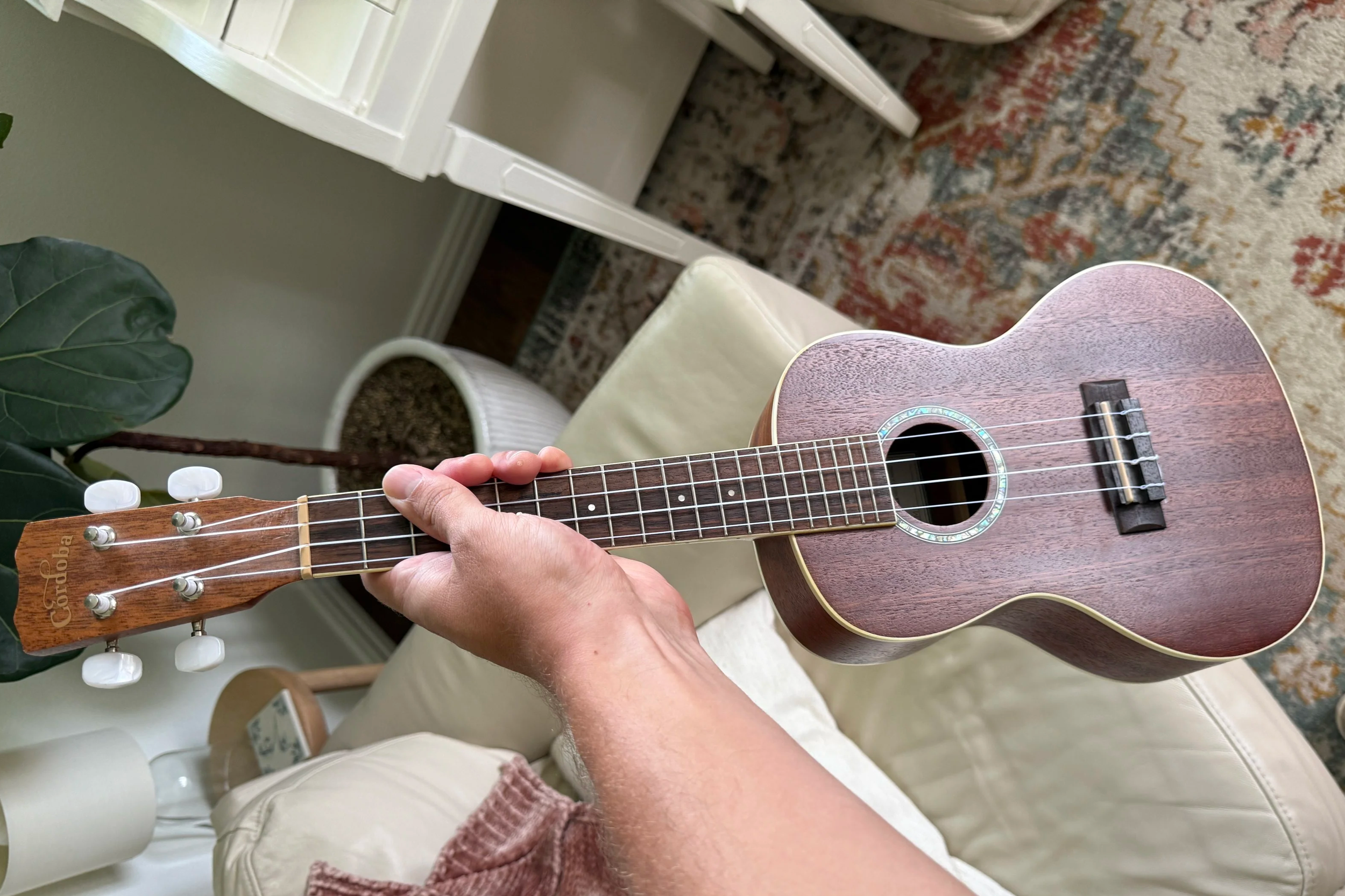 Child learning ukulele with a private instructor — fun beginner music lessons in Dallas, Austin, and online