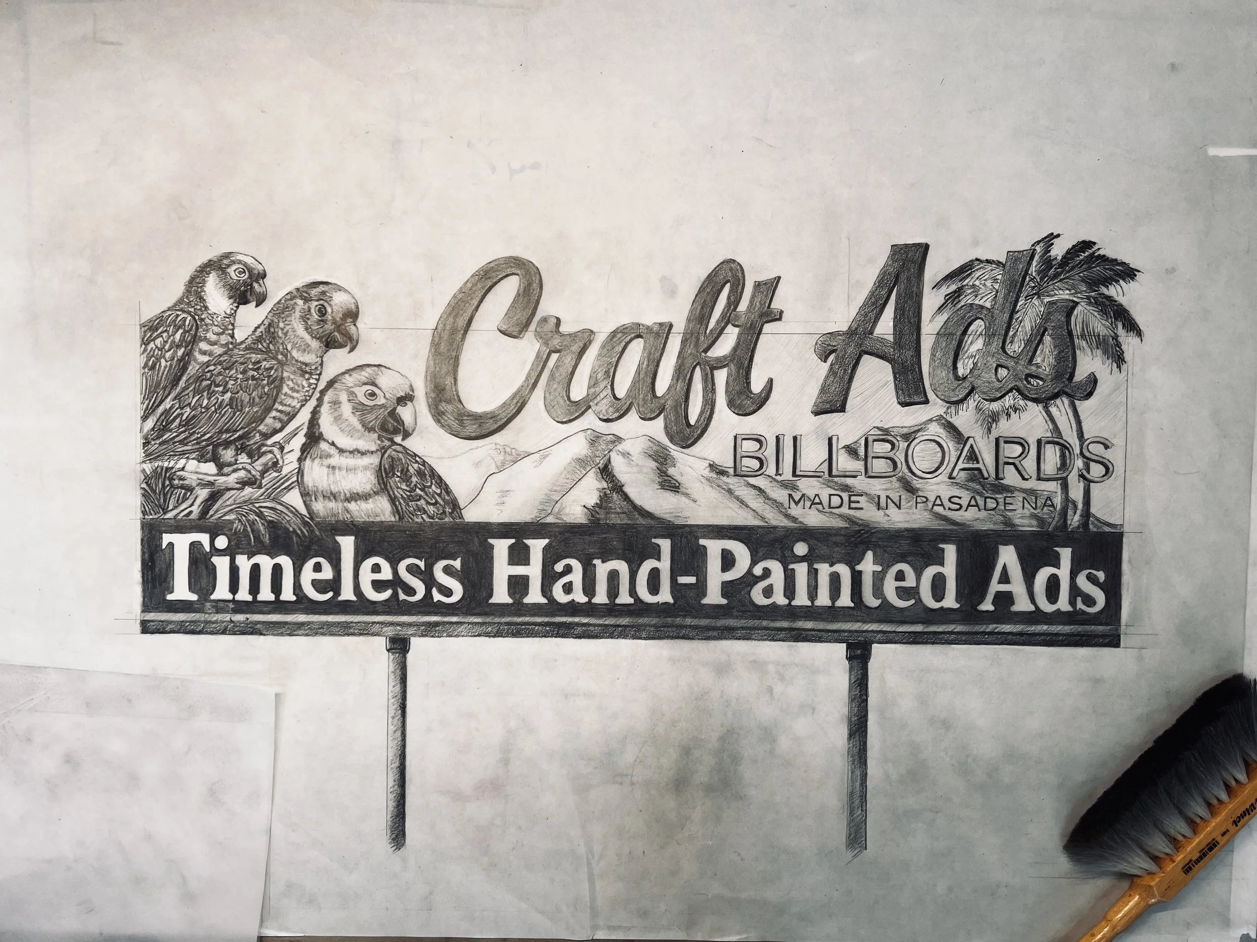 Hand-drawn billboard advertisement for craft ads, featuring parrots, palm trees, mountain scenery, and text promoting hand-painted ads made in Pasadena.