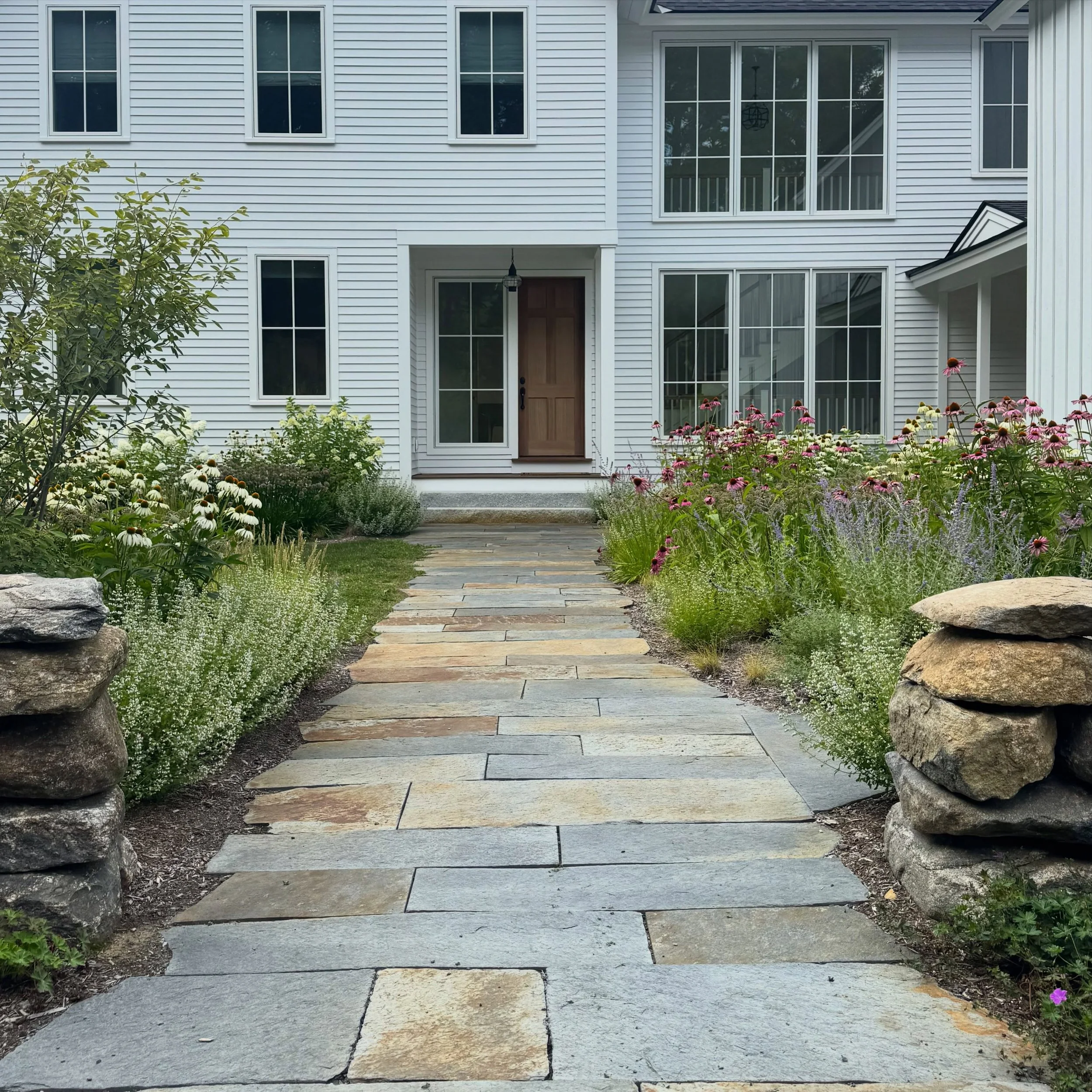 Planks of Goshen stone are one of my favorite ways to blend structure and character. 

Perhaps this is a dramatic take, but irregular flagstone can be the best or worst thing you do in a garden&mdash; dependent entirely on the craftsmen involved. Cou