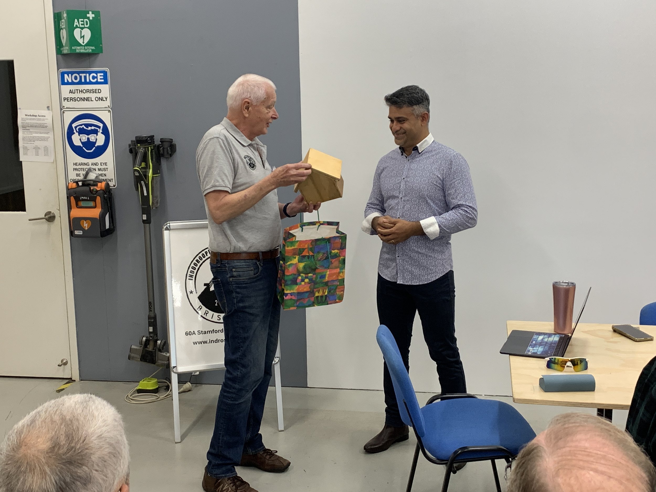 Pieter Scheelings presenting April 2025s guest speaker Charles Joseph with a thank you gift for his presentation on Artificial Intelligence.