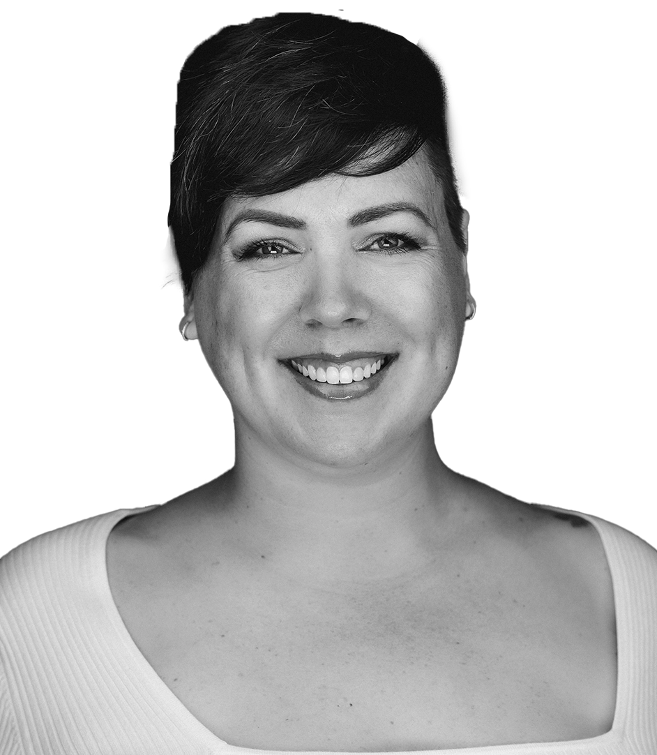 Erika Matkovich with short dark hair wearing a light-colored top, photographed against a white background.