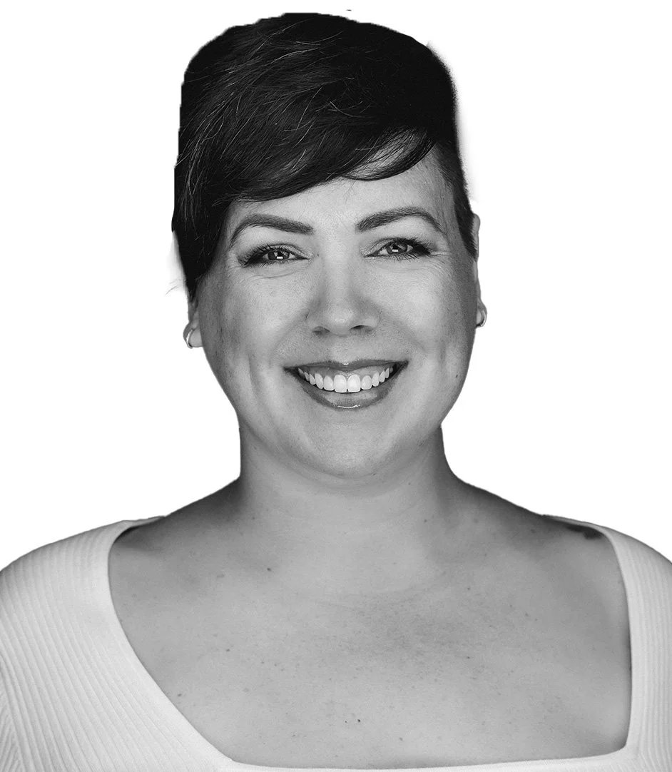Black-and-white portrait of Erika Matkovich smiling, with short dark hair, wearing a light-colored top with a squared neckline.