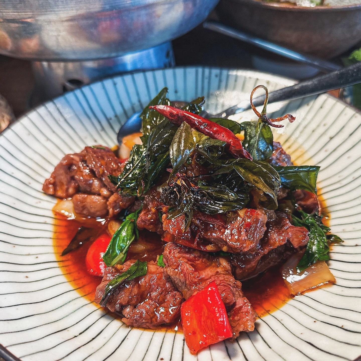 #thaithursday Can&rsquo;t go wrong with Nuer Nam Pik Pao 🥩🌶️ Saut&eacute;ed Thai chili, diced beef, onion, bell pepper &amp; fresh basil leaves in house chili jam. 🌿🔥 Saucy &amp; spicy! 

📸 @katheerinnaeats 

🔗 Order take out/ Make reservation 