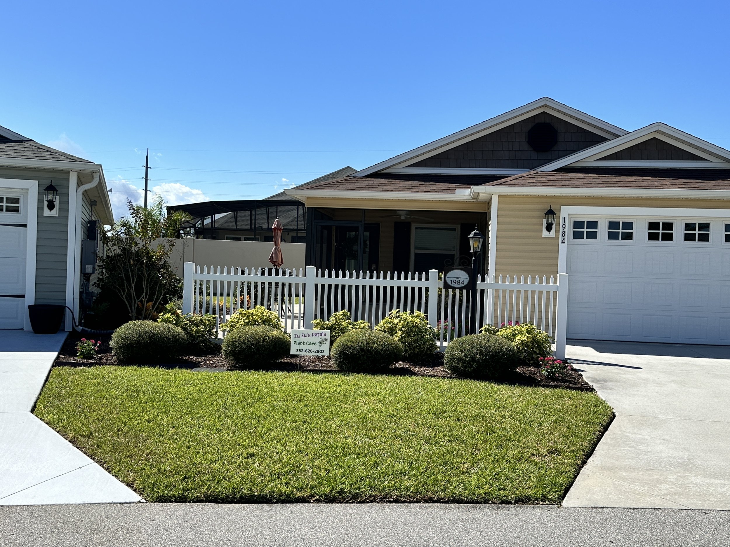 AFTER - new annual flowers planted, lawn fertilized, grubs treated, and shrubs trimmed