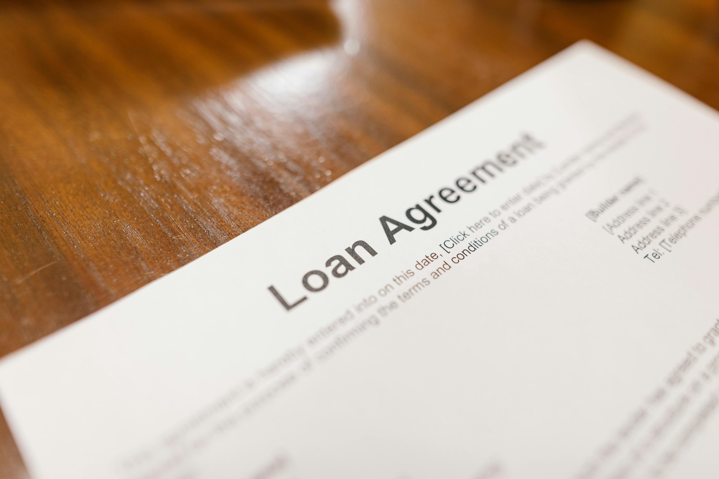 A mortgage agreement on a desk, representing the financial strategy of recasting a home loan.