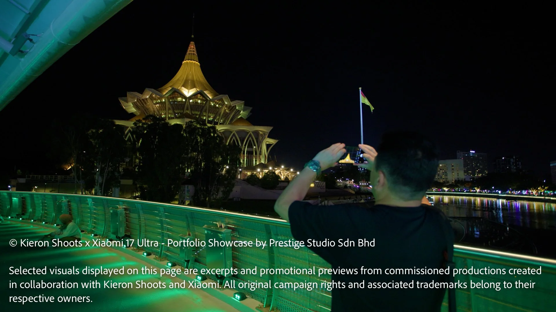 Photographer capturing the Sarawak State Legislative Assembly building using the Xiaomi 17 Ultra at Kuching Waterfront.