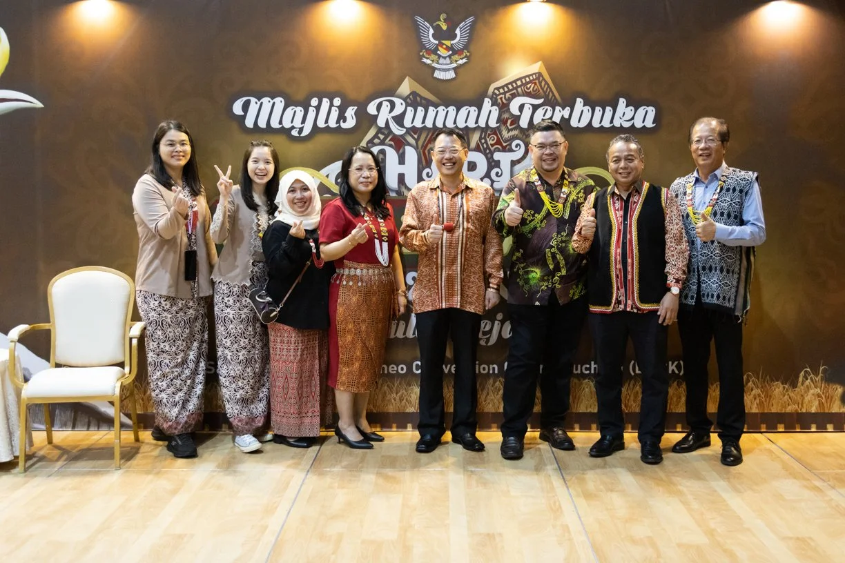 Group photo at Majlis Rumah Terbuka Gawai Dayak in BCCK Kuching, captured during an official cultural event.