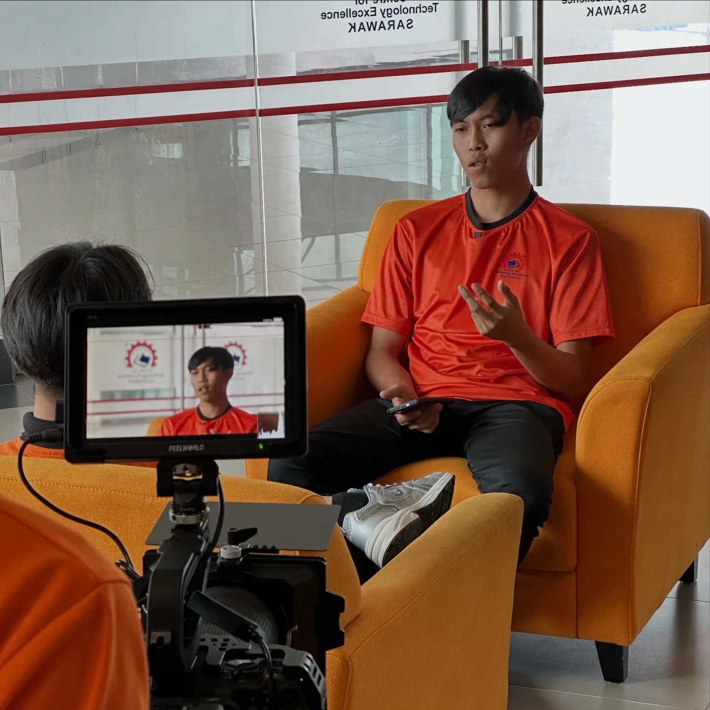 CENTEXS student practising a corporate interview on camera as part of professional video production training on location