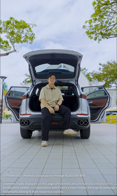 Talent sitting at the rear cargo space of the Proton X50 with boot open