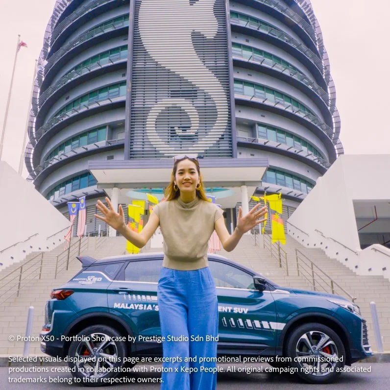 Presenter standing in front of Proton X50 outside Dewan Bandaraya Miri