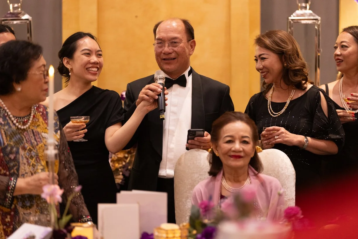 Speaker delivering a speech during a formal dinner event in Kuching, captured at the Waterfront Hotel, Kuching, as part of professional event photography coverage.