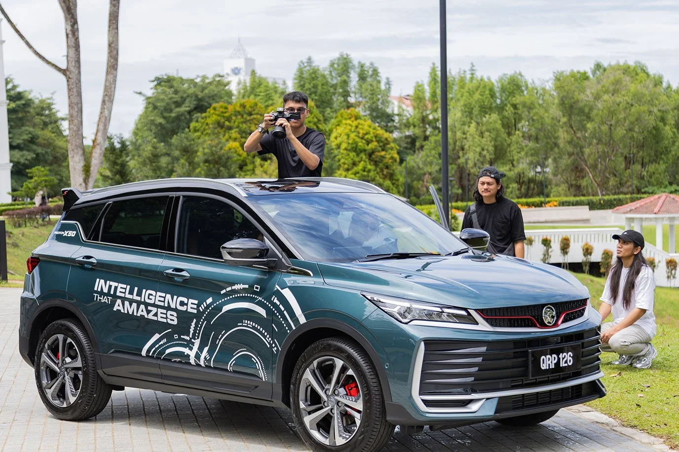Behind-the-scenes filming of social media reels for the launch of the Proton X50 in Kuching, showing the production crew capturing automotive visuals on location.