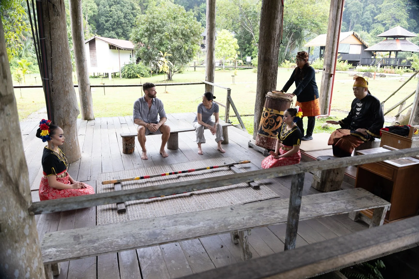 Wide view of traditional cultural performance setup during a Sarawak Tourism commercial shoot in a village setting