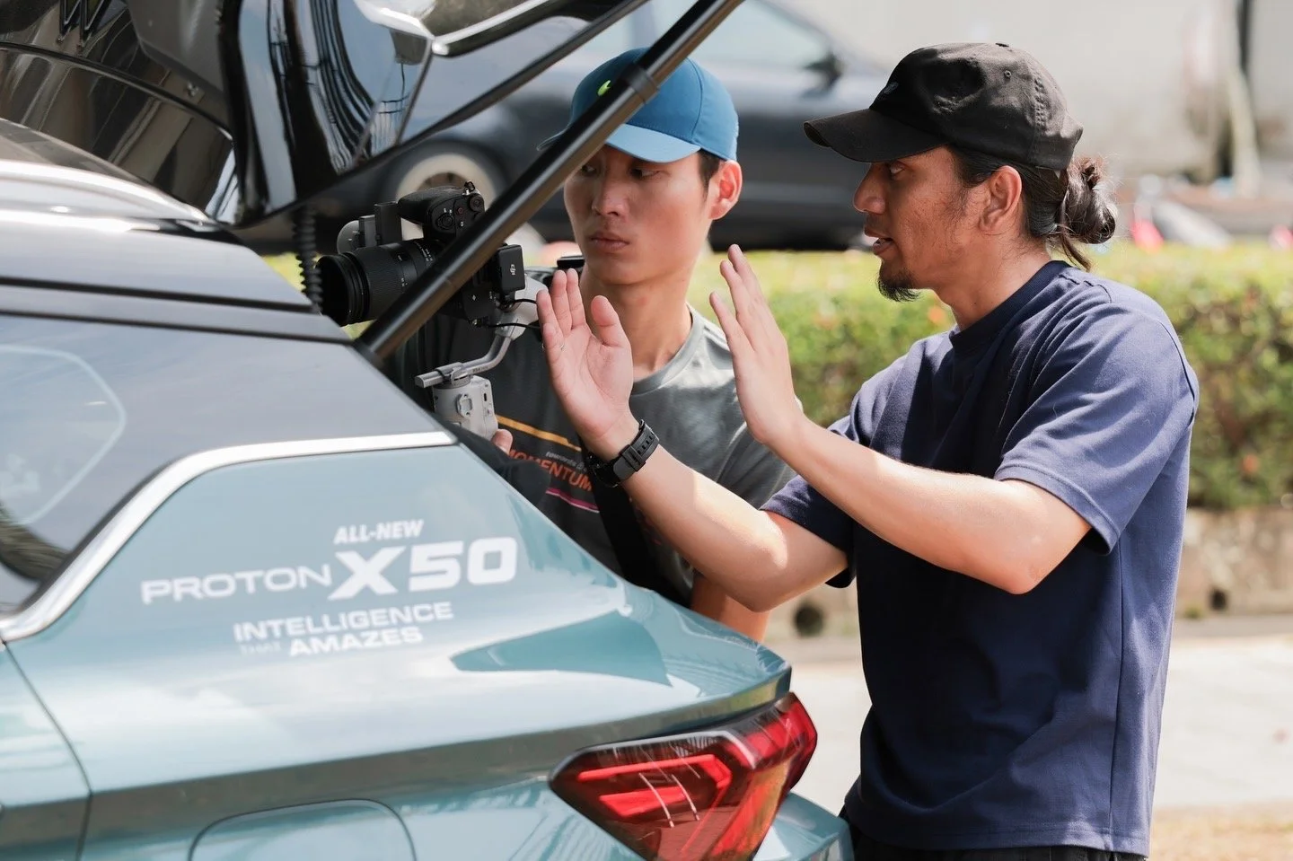 Behind-the-scenes video production for Proton X50 in Kuching, showing the crew coordinating an on-location automotive shoot.